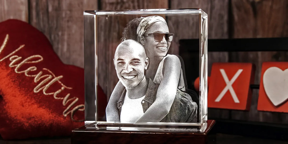 A personalized 3D crystal featuring a joyful couple with the woman hugging the man from behind, displayed on a wooden base wit