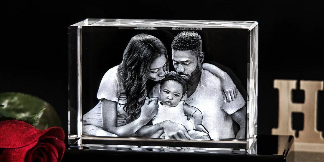Rectangular 3D crystal with an etched image of a mother and father lovingly holding their baby, displayed against a black back