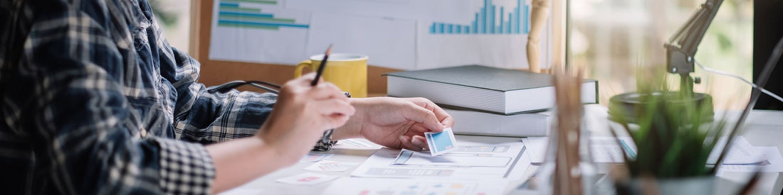 A stylish workspace with modern decor, showcasing how to design a space that reflects your online brand.