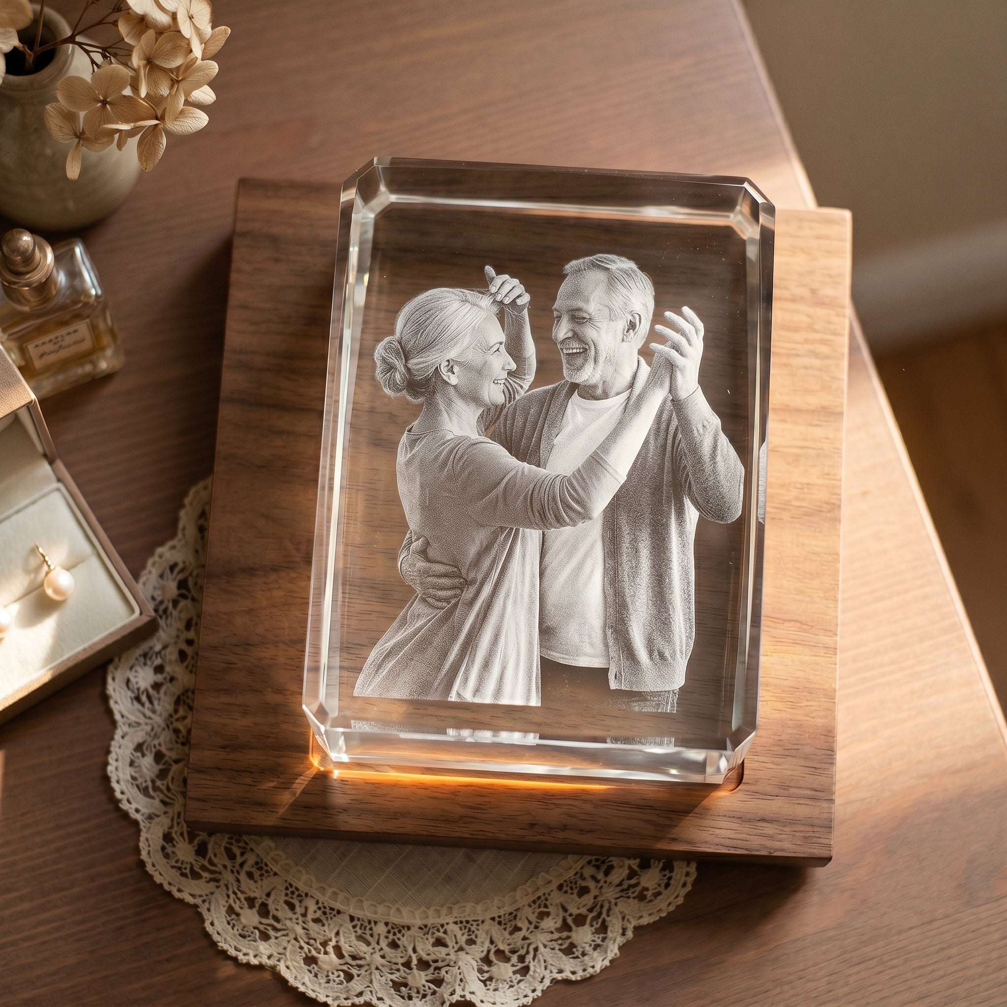 Walnut rectangle 3D Crystal with candid older couple in a living-room dance engraved in pure grayscale, cream lace doily under the base on a dresser top for a 39th anniversary scene